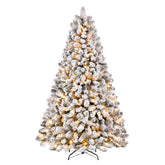 Pre-lit white flocked artificial Christmas tree with warm white lights, showcasing snowy branches and festive holiday decor.