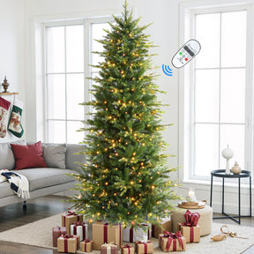 Four 4-foot Aspen Slim Noble Fir artificial Christmas trees with colorful multi-color lights, perfect for holiday decorating.