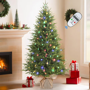 Small artificial Christmas tree with multi-color lights, remote control, realistic design, perfect for tabletop holiday decor.